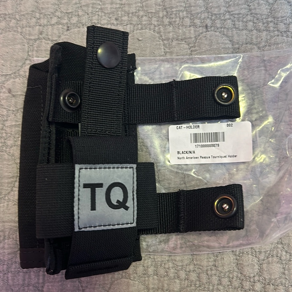 Like new in package North American rescue tourniquet holder black